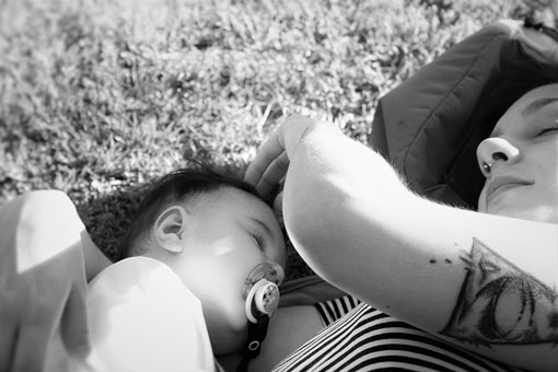 sleeping baby with mother