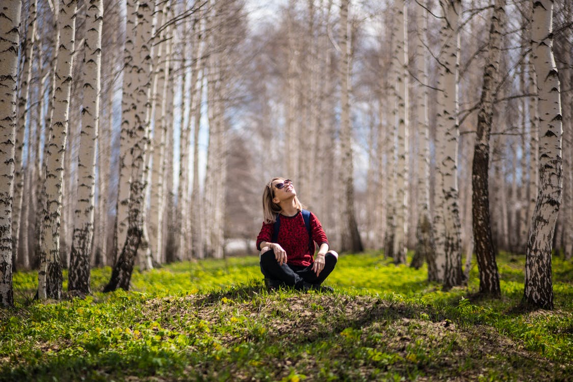 woman sitting in jungle 